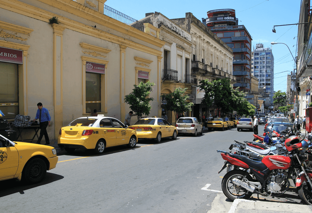 Taxi and bikes parked nearby road
