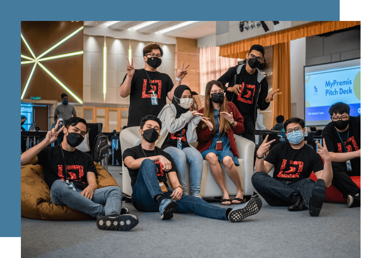 BeSquare students standing with their laptops